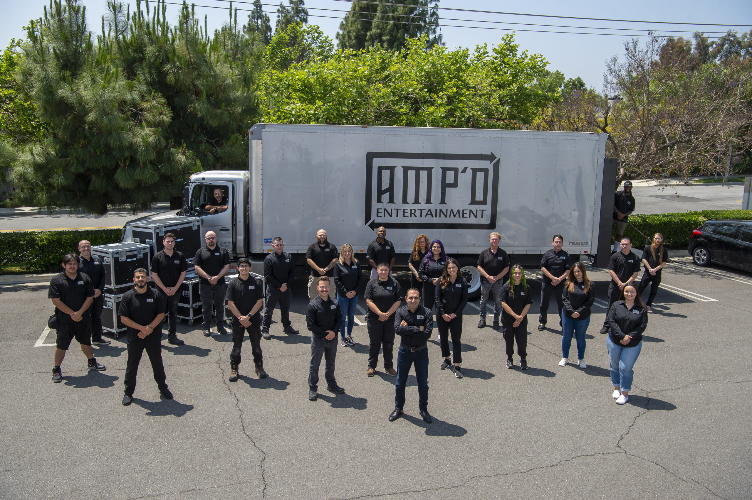amp'd entertainment crew in the parking lot in front of amp'd entertainment truck